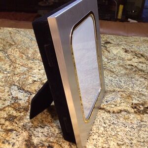 Silver/gold picture frame also stores pictures NWOT.